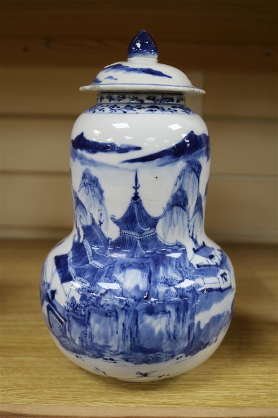 A Chinese blue and white gourd-shaped vase and cover, late 19th century, height 28cm